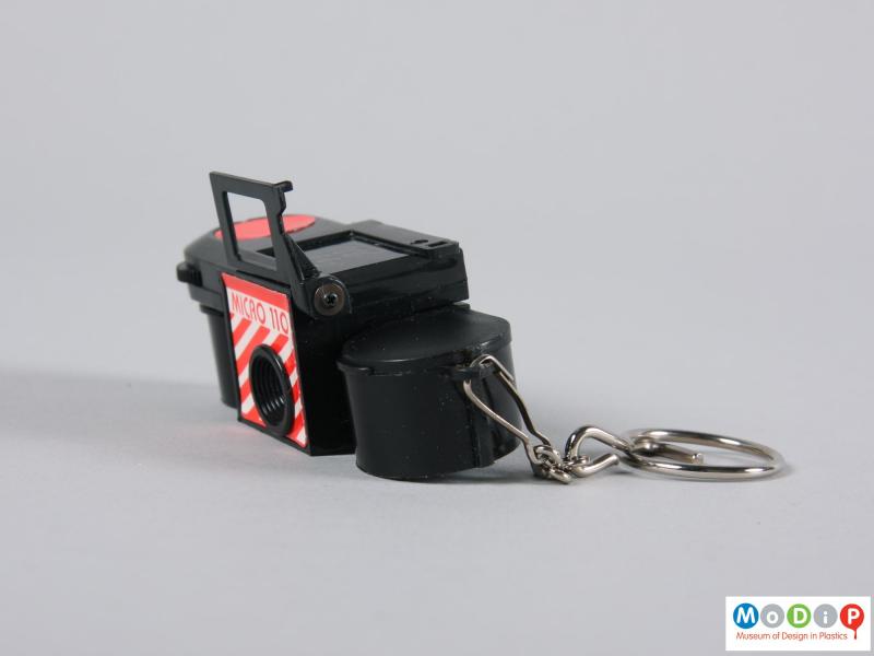 Side view of a camera showing the metal keyring.