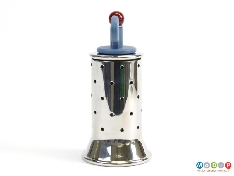 Side view of a pepper grinder showing dot design on the metal body.