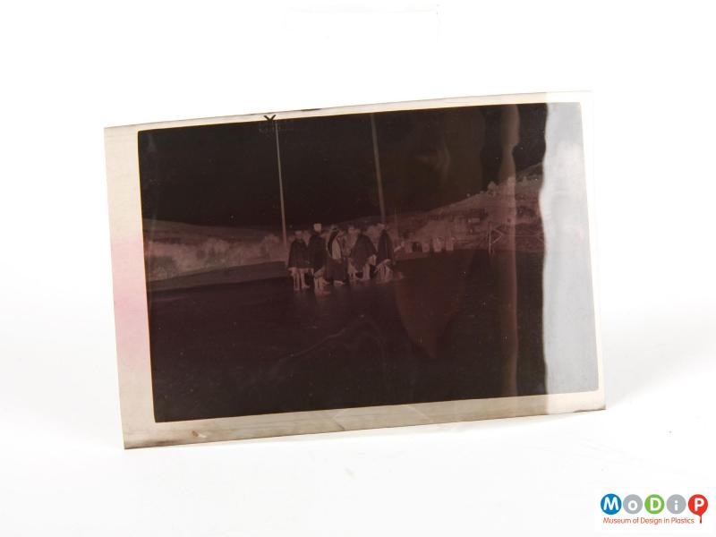 Front view of an album of negatives showing one of the negatives.