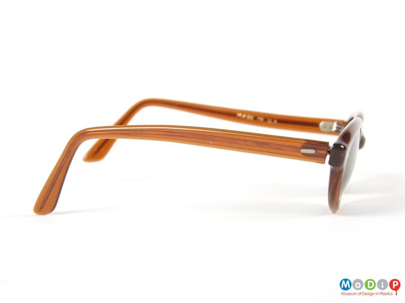 Side view of a pair of sunglasses showing the arms.