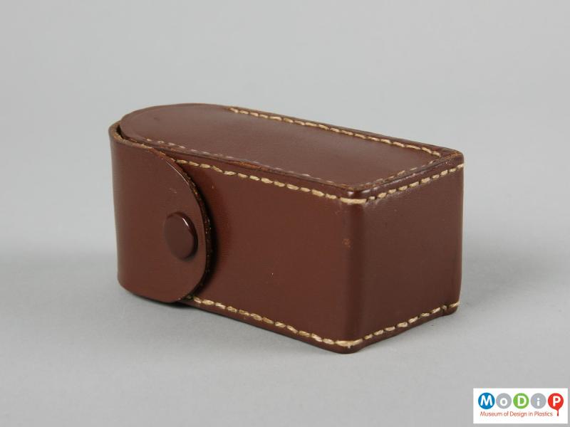 Side view of a flash unit showing the leather case.