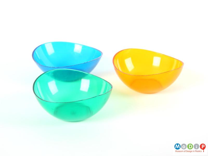 Side view of three bowls showing the asymmetric shape.