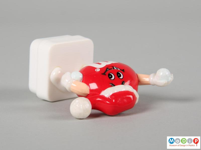 Top view of a red M&M figure showing the depth of the figure.