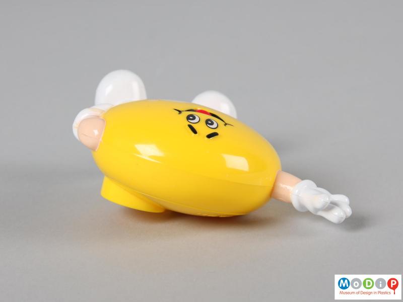 Top view of a yellow M&M figure showing the depth of the dispenser.