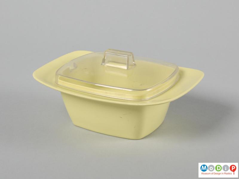 Side view of a butter dish showing the elongated shape.