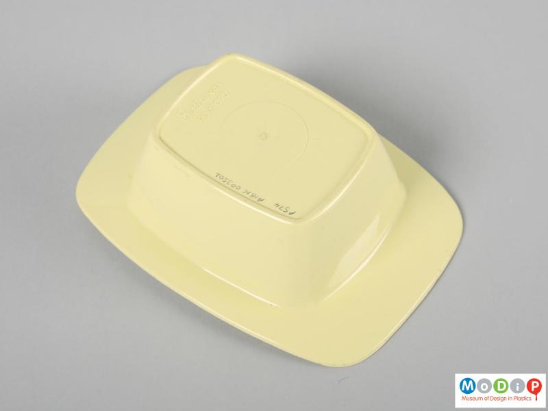 Underside view of a butter dish showing the base.