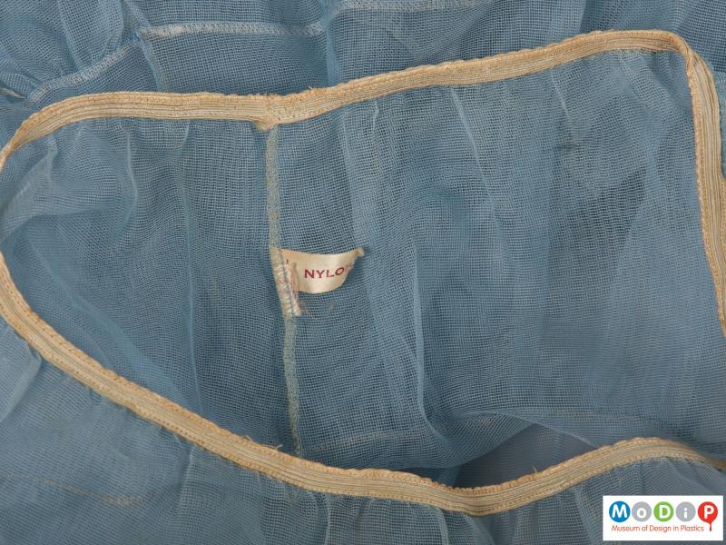Close view of an underskirt showing the label.