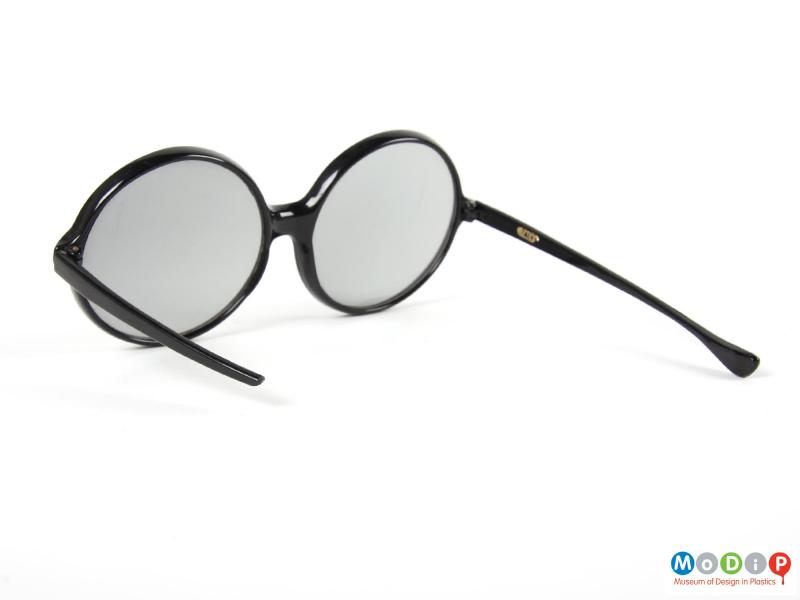 Side view of a pair of sunglasses showing the broken arm.