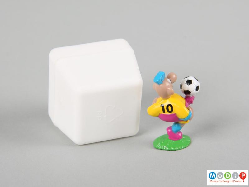 Rear view of a football figure showing the back of the footballer and the top of the box.