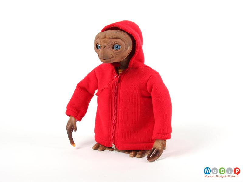 Front view of a doll showing the red hooded jacket.