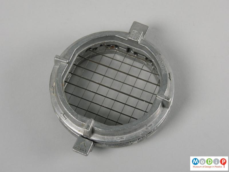 Top view of a food chopper showing the metal blades.