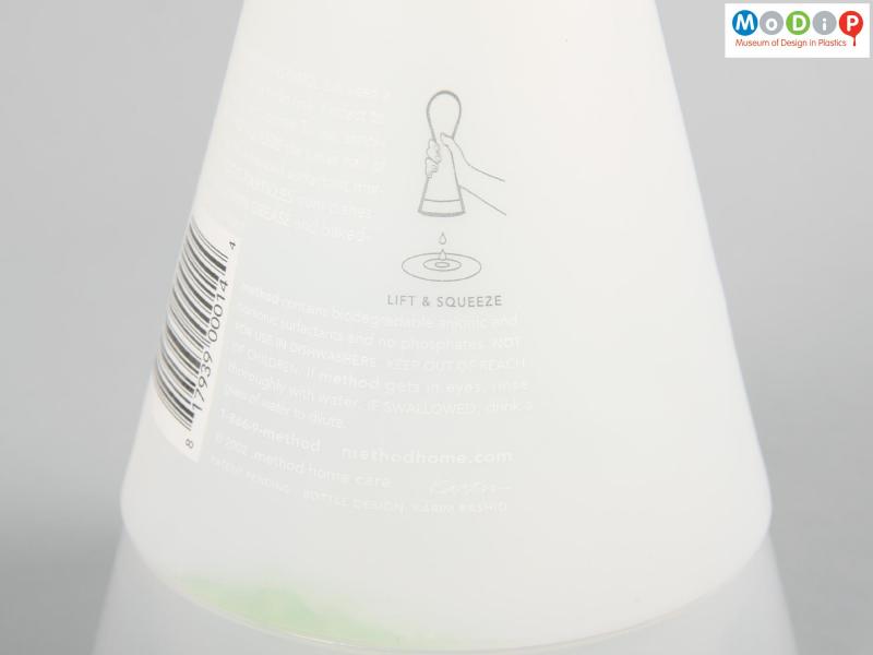 Close view of a Method bottle showing the printed signature of Karim Rashid.
