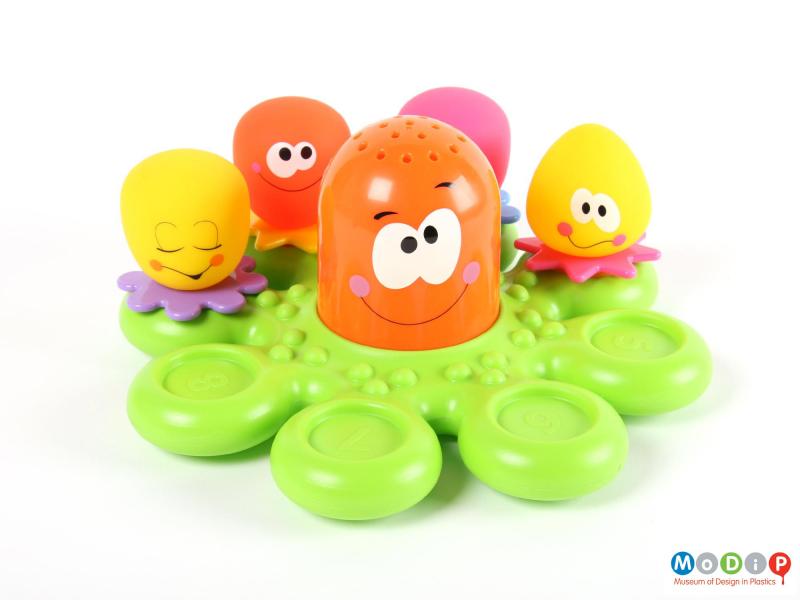 Front view of a bath toy showing some of the figures removed to show the numbered spaces.