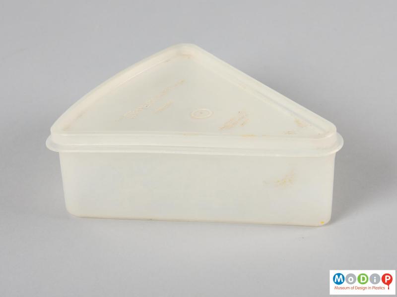 Side view of a Tupperware container showing one of the stright sides.
