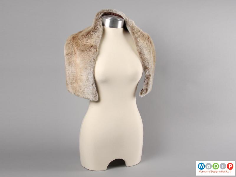 Front view of a synthetic fur scarf showing the scarf draped over both shoulders of a mannequin.