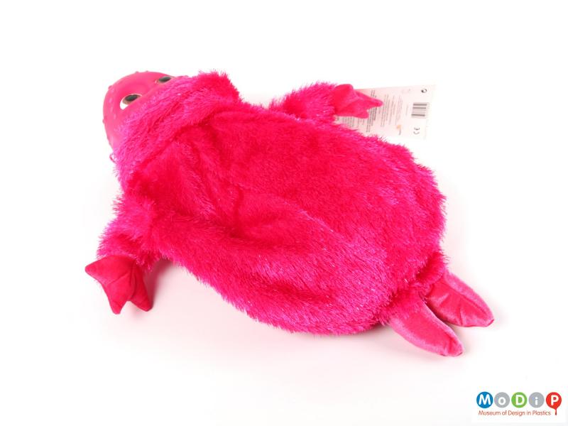 Side view of a hot water bottle cover showing its fuzzy body.