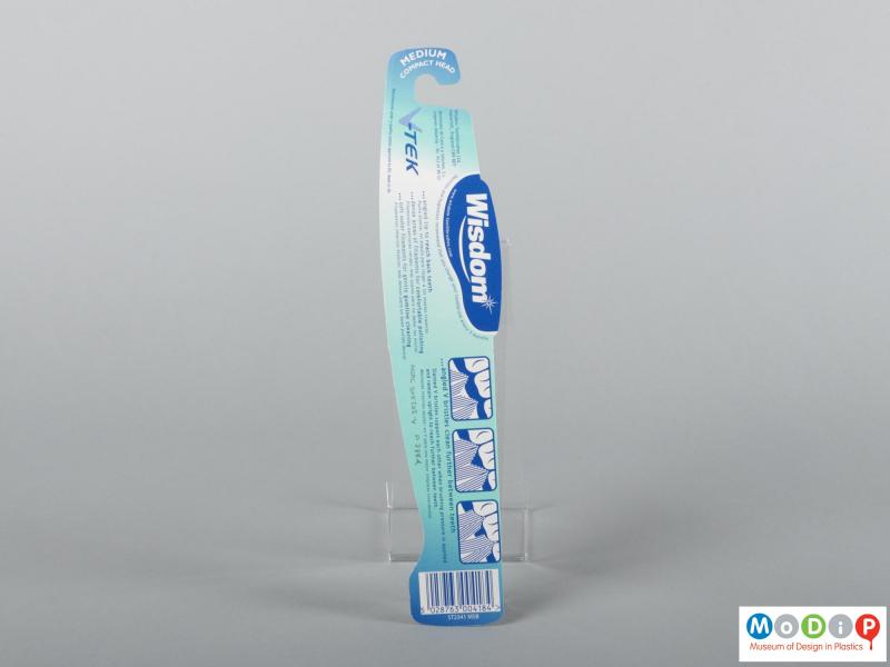 Rear view of a pair of packaged toothbrushes showing the packaging.