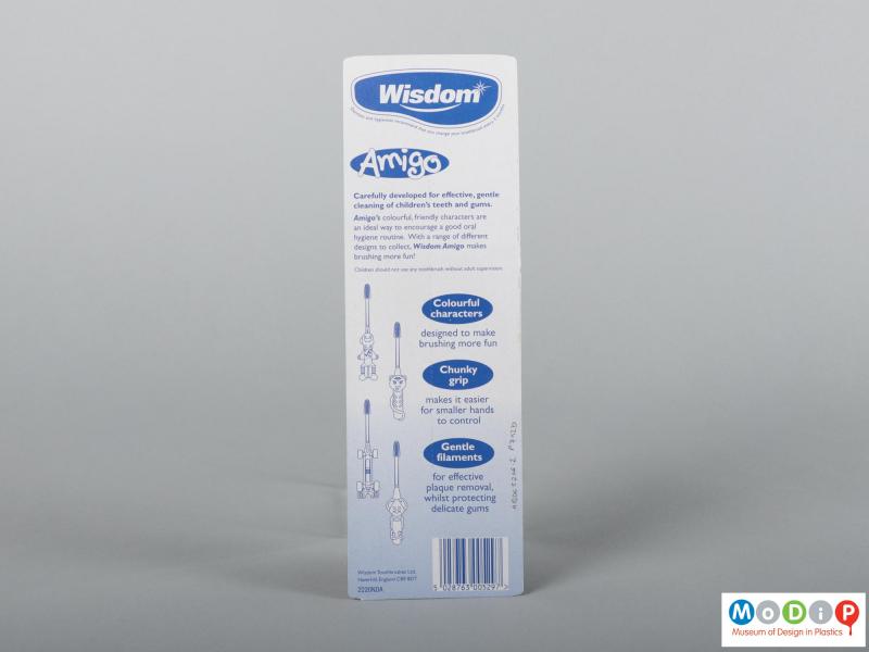 Rear  view of a pair of packaged toothbrushes showing the packaging.
