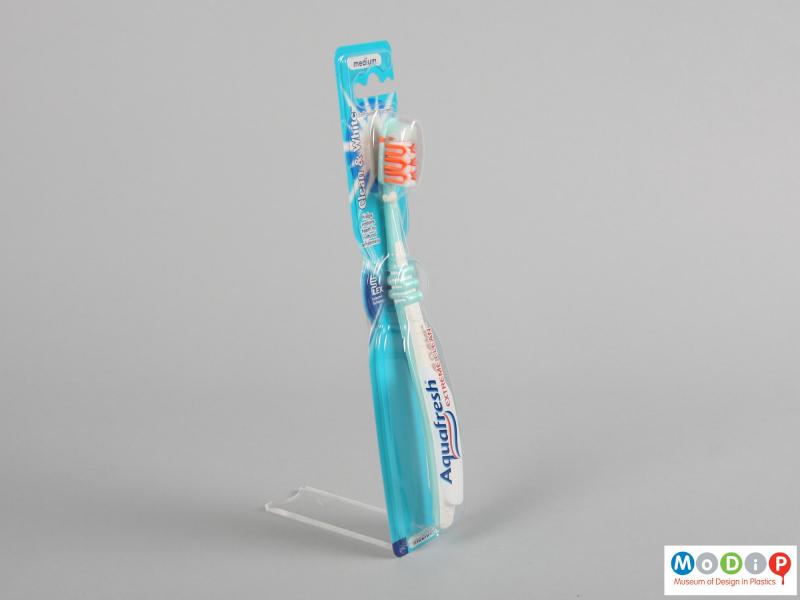 Side view of a toothbrush showing the flexible handle.