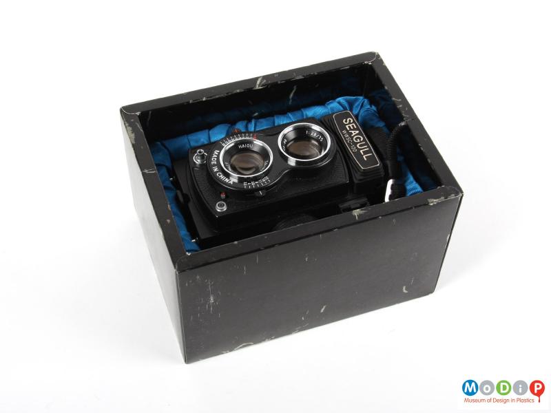 Top view of a camera showing the original box.