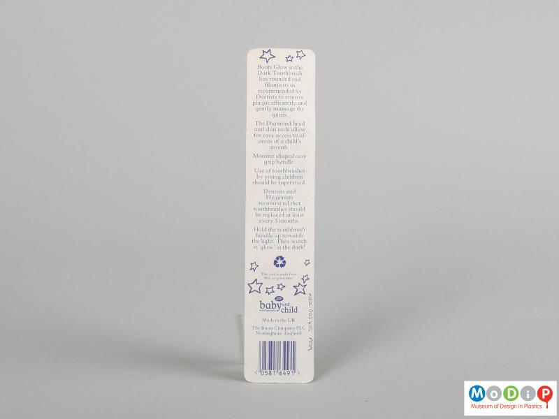 Rear view of a toothbrush showing the back of the packaging.