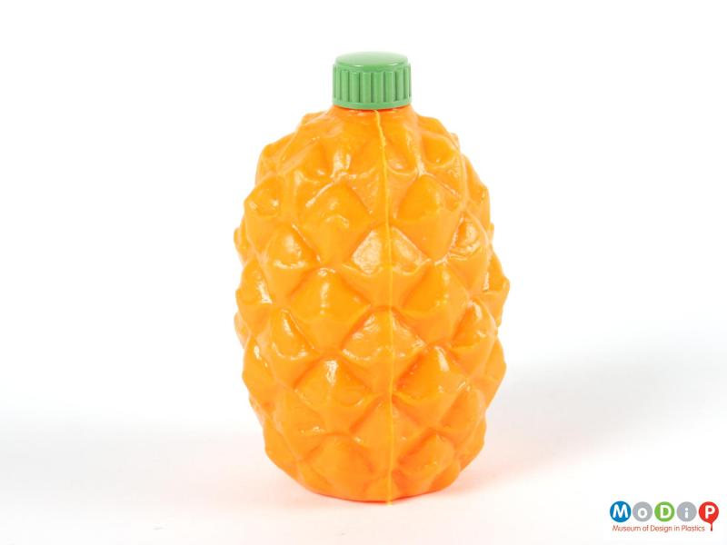 Side view of a pineapple syrup bottle showing the moulding seam running down the side.