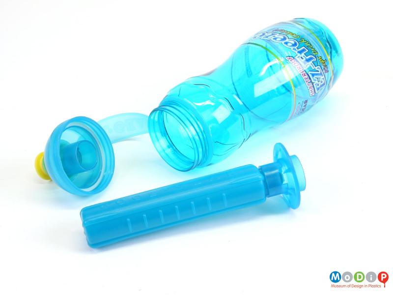 Close view of a drinks bottle showing the opened lid and removed central core.