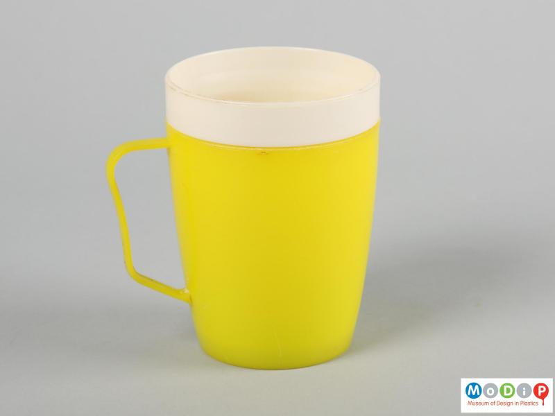 Side view of a mug showing the thin handle.