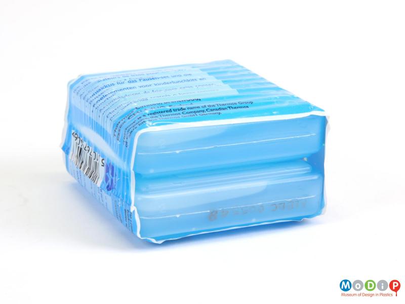 Side view of a pack of two small ice packs showing the blow moulding seams.