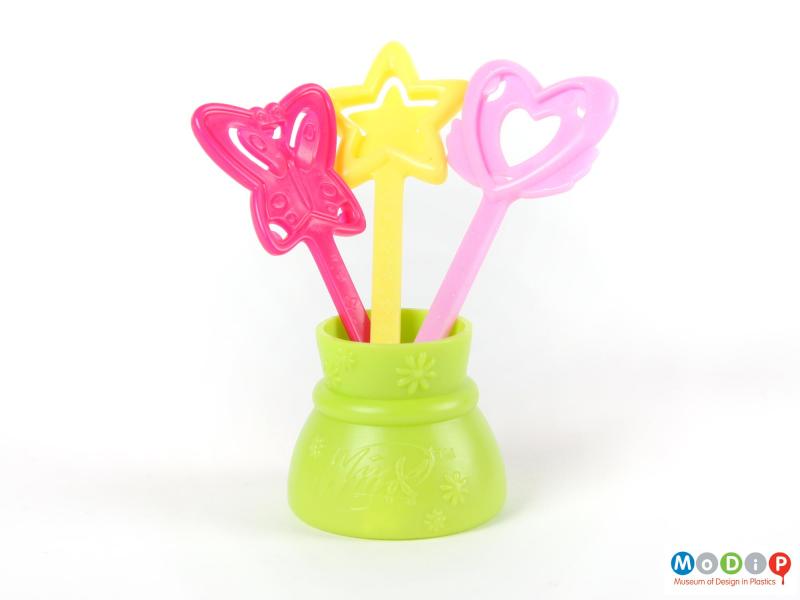 Front view of a Winx Club wand set showing the three wands standing in the pot.