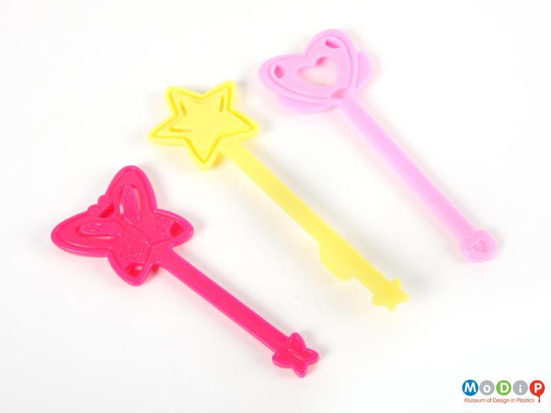 Underside view of a Winx Club wand set showing the three wands.