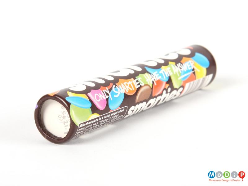 Underside view of a Smarties tube showing the base.