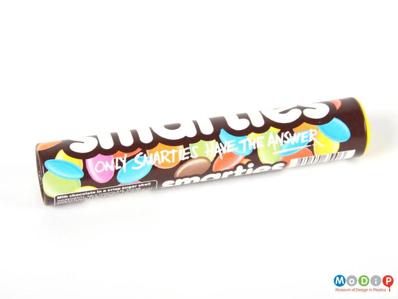Side view of a Smarties tube showing the printed decoration.