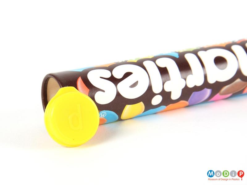 Underside view of a Smarties tube showing the lid.