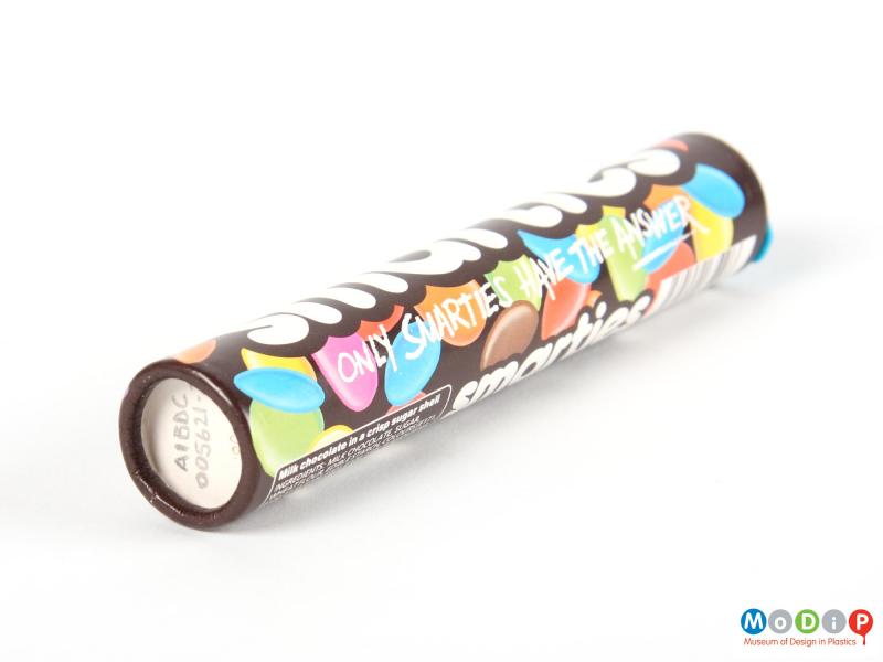 Underside view of a Smarties tube showing the base.