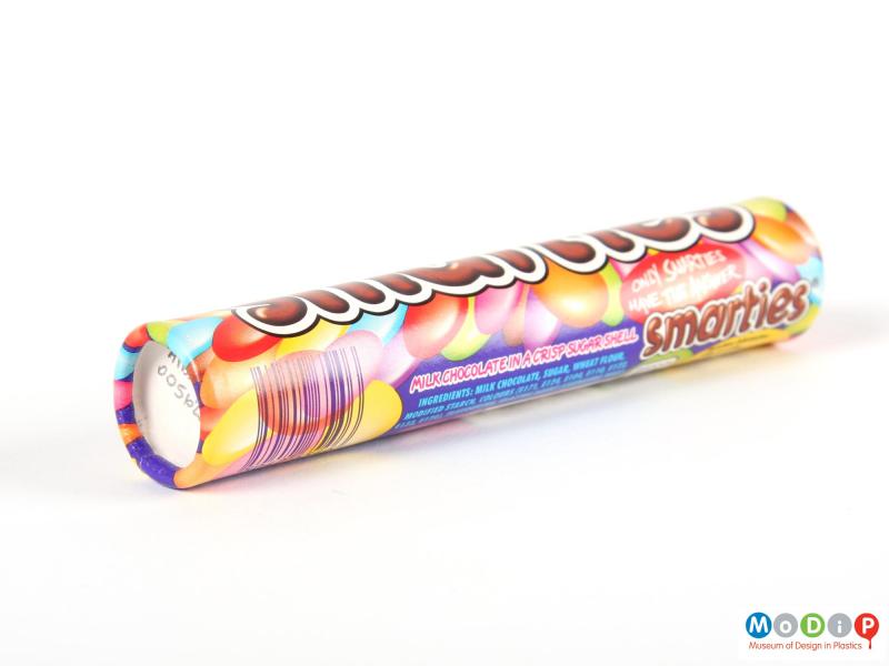 Underside view of a Smarties tube showing the base.