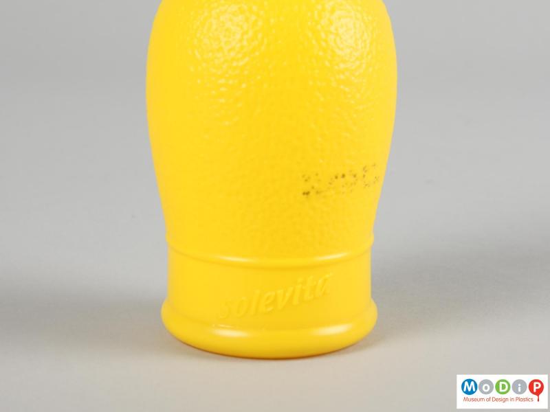 Close view of a lemon juice bottle showing the moulded inscription in the side.