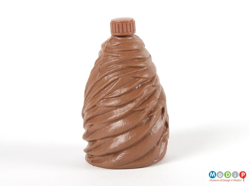 Side view of a syrup bottle showing the moulded texture.