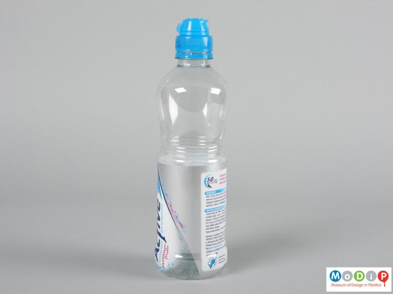 Side view of a bottle showing the shrink wrapped label.
