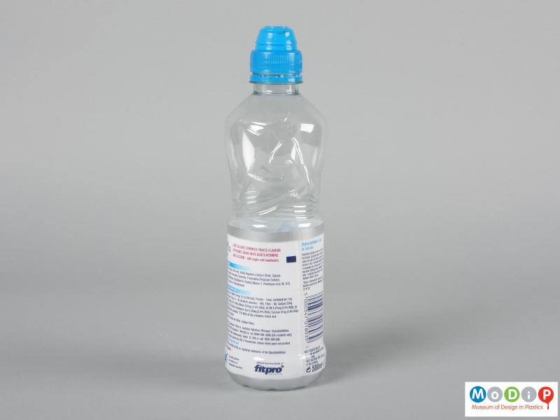 Side view of a bottle showing the shrink wrapped label.