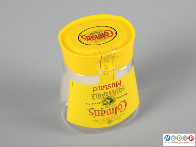 Underside view of a Colman's Mustard jar showing the foot running around the edge of the lid.