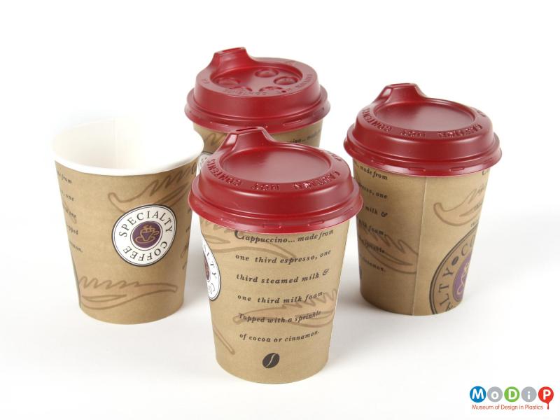 Top view  of three Smart Lids and paper cups showing the two different types of lid.