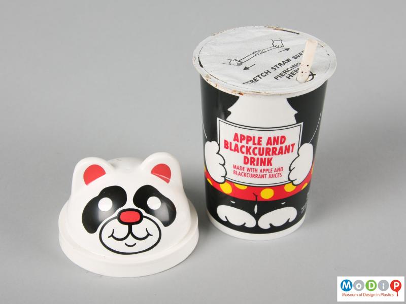 Top view of a Panda cup showing the lid removed to expose the internal foil and straw.