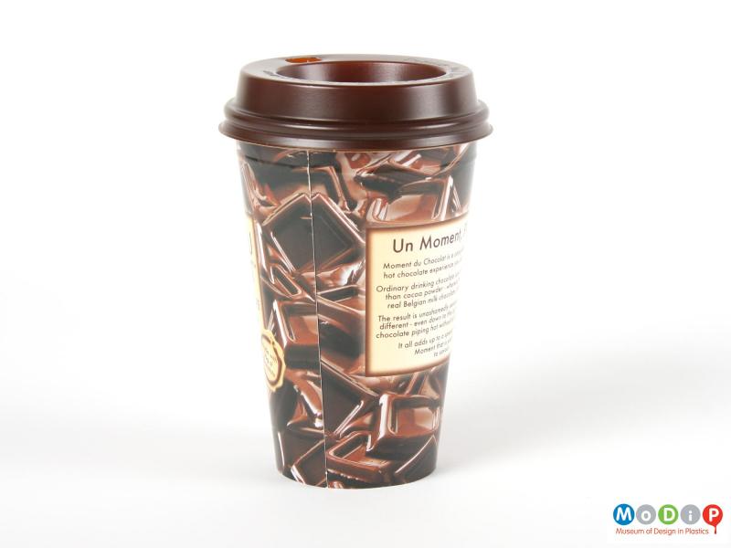 Side view of a Moment Du Chocolat cup showing the tapering shape and printed sides.