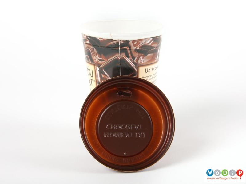 Close view of a Moment Du Chocolat cup showing the inside of the lid.