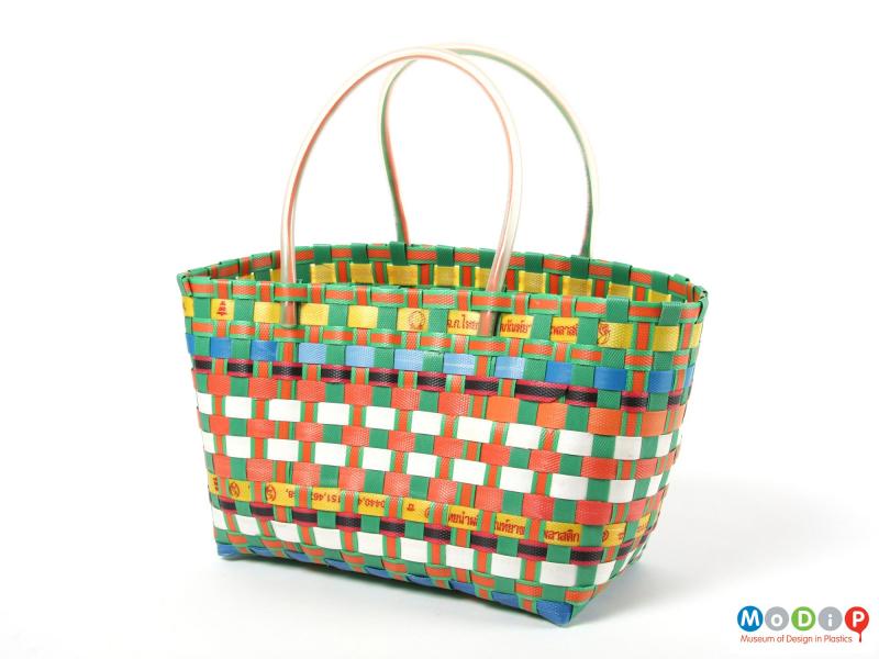 Side view of a basket showing the handles made of tubing.