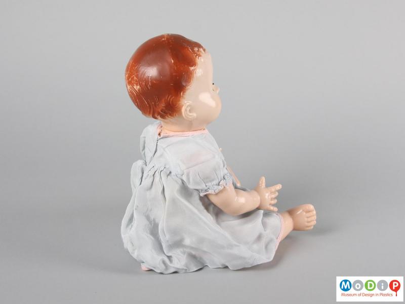 Rear view of a Pedigree doll showing the moulded hair and painted head.