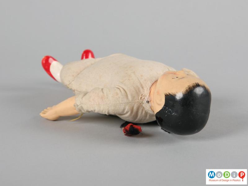Top view of a doll showing the painted deatil of the hairline.