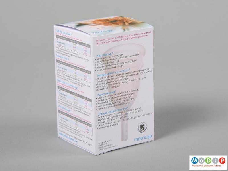 Side view of a menstrual cup showing the packaging.