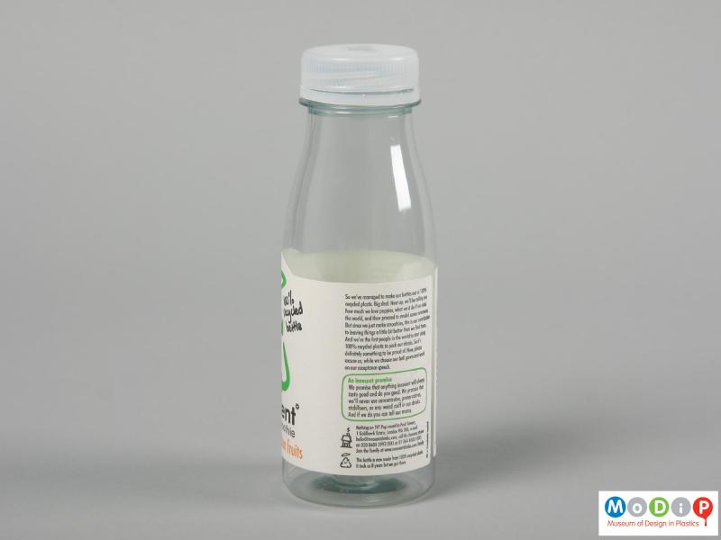 Side view of an Innocent Smoothie bottle showing the position of the paper label on the bottle.